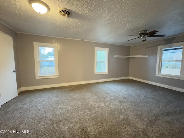 909 4th St, Elizabeth City, NC 27909 - spare room with a textured ceiling, ceiling fan, baseboards, carpet, and crown molding