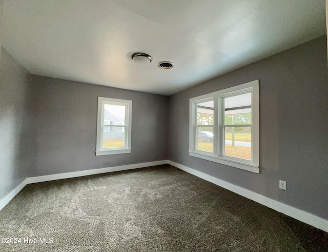 909 4th St, Elizabeth City, NC 27909 - carpeted spare room featuring baseboards