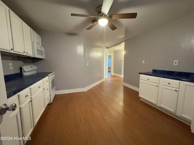 909 4th St, Elizabeth City, NC 27909 - kitchen featuring white appliances, dark wood-type flooring, ceiling fan, white cabinetry, and baseboards