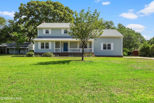 209 Inlet Dr, Wilmington, NC 28411 - view of front of house with covered porch, a chimney, and a front yard