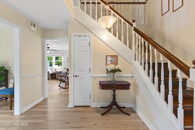209 Inlet Dr, Wilmington, NC 28411 - stairway featuring wood finished floors, baseboards, and a ceiling fan