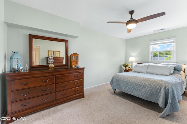 209 Inlet Dr, Wilmington, NC 28411 - bedroom featuring light carpet, a ceiling fan, and baseboards