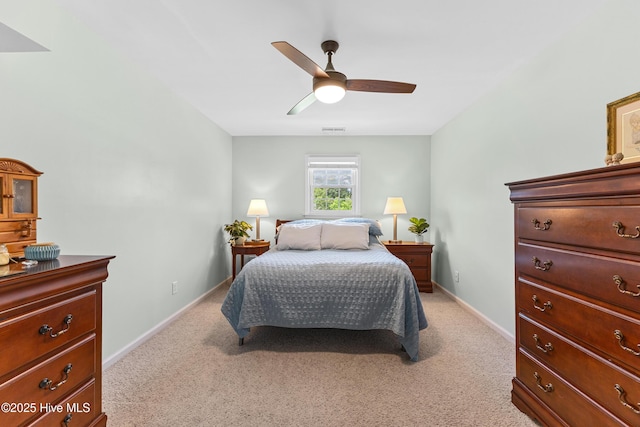 209 Inlet Dr, Wilmington, NC 28411 - bedroom with light colored carpet, baseboards, and a ceiling fan