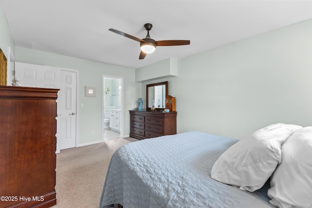 209 Inlet Dr, Wilmington, NC 28411 - carpeted bedroom featuring baseboards, connected bathroom, and ceiling fan