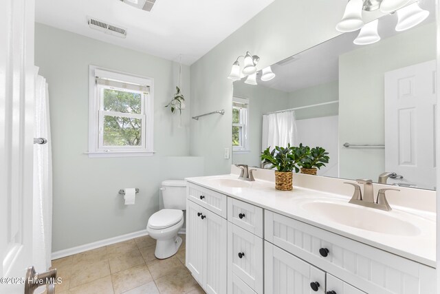 209 Inlet Dr, Wilmington, NC 28411 - full bath with toilet, double vanity, baseboards, a shower with curtain, and tile patterned floors