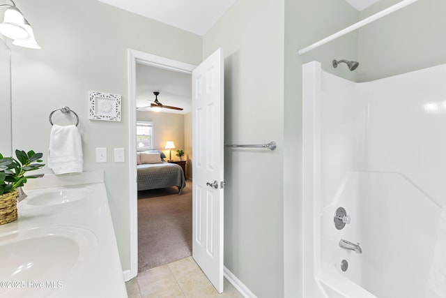 209 Inlet Dr, Wilmington, NC 28411 - bathroom with bathtub / shower combination, tile patterned floors, double vanity, connected bathroom, and ceiling fan