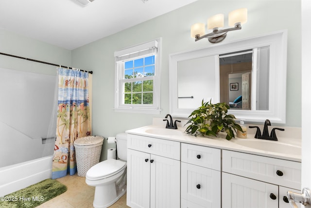 209 Inlet Dr, Wilmington, NC 28411 - bathroom featuring double vanity, toilet, shower / bath combination with curtain, and tile patterned floors