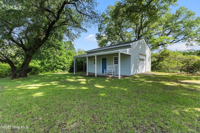 209 Inlet Dr, Wilmington, NC 28411 - view of front of property featuring a garage, a front yard, and covered porch