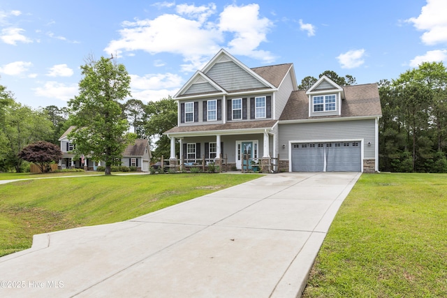 112 Norine Dr, Holly Ridge, NC 28445 - craftsman house with a porch, stone siding, driveway, and a front lawn