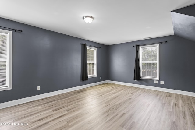 112 Norine Dr, Holly Ridge, NC 28445 - empty room with wood finished floors, baseboards, and lofted ceiling