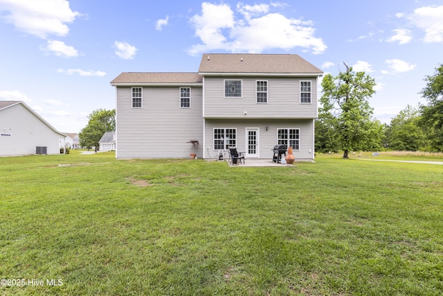 112 Norine Dr, Holly Ridge, NC 28445 - rear view of house featuring a patio area, a yard, and central AC unit