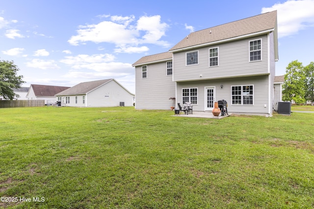 112 Norine Dr, Holly Ridge, NC 28445 - back of house with central air condition unit, a patio area, and a shingled roof
