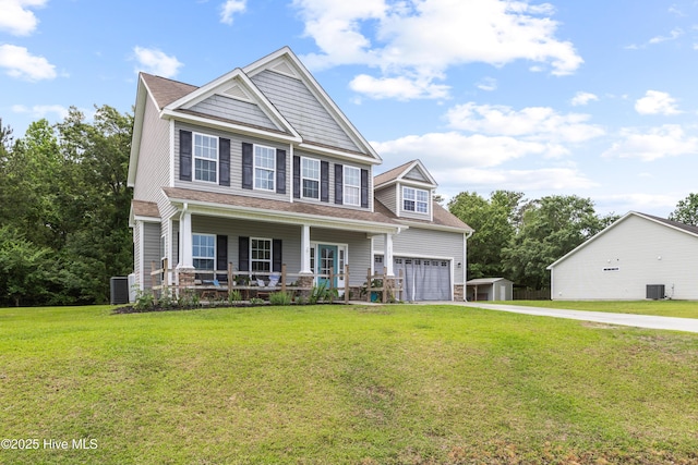 112 Norine Dr, Holly Ridge, NC 28445 - craftsman house featuring a porch, concrete driveway, a front lawn, and cooling unit