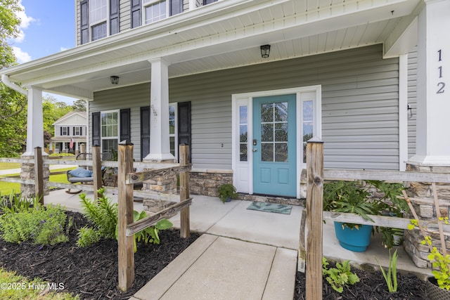 112 Norine Dr, Holly Ridge, NC 28445 - property entrance with a porch and stone siding