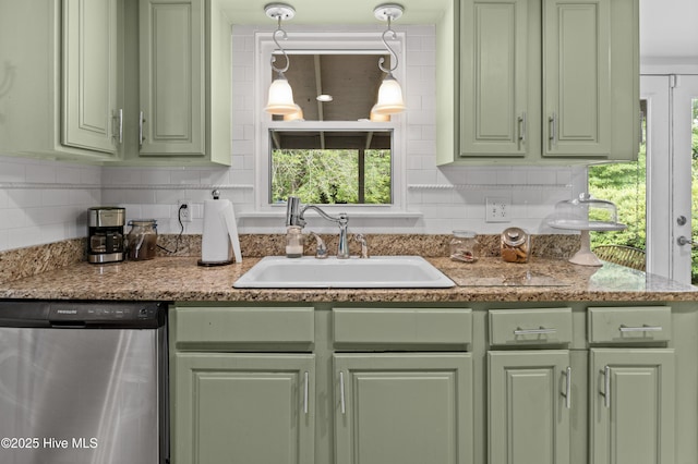 807 Cheryl Ln, Wilmington, NC 28405 - kitchen featuring stainless steel dishwasher, green cabinets, a sink, and decorative backsplash