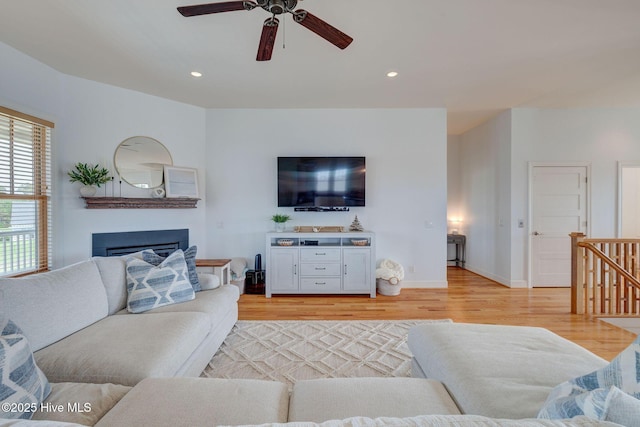 353 Spicer Lake Dr, Holly Ridge, NC 28445 - living area with a ceiling fan, light wood-type flooring, a glass covered fireplace, recessed lighting, and baseboards