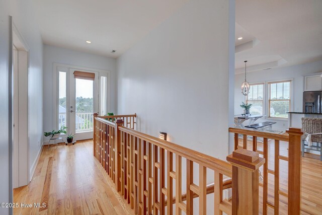 353 Spicer Lake Dr, Holly Ridge, NC 28445 - hallway featuring an upstairs landing, healthy amount of natural light, light wood-style flooring, recessed lighting, and baseboards