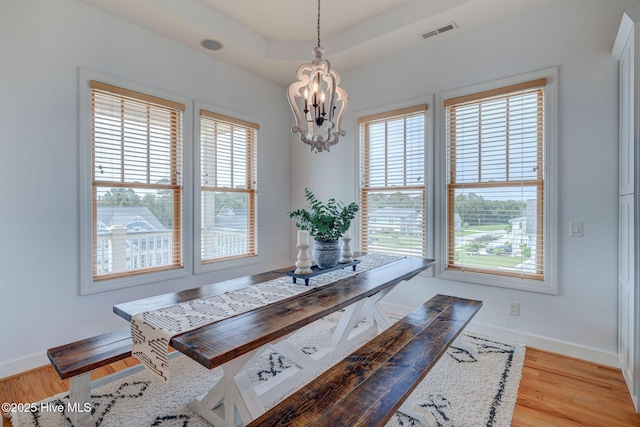 353 Spicer Lake Dr, Holly Ridge, NC 28445 - dining area featuring a chandelier, baseboards, and light wood-style floors