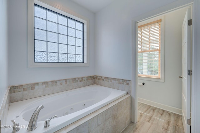 353 Spicer Lake Dr, Holly Ridge, NC 28445 - full bathroom with a jetted tub, wood finished floors, and baseboards