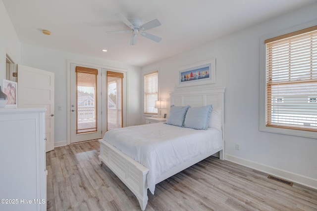 353 Spicer Lake Dr, Holly Ridge, NC 28445 - bedroom featuring multiple windows, light wood-style flooring, baseboards, and recessed lighting