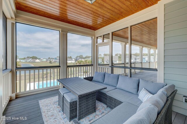 353 Spicer Lake Dr, Holly Ridge, NC 28445 - sunroom featuring outdoor lounge area and a residential view