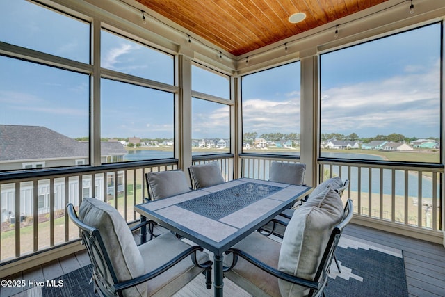 353 Spicer Lake Dr, Holly Ridge, NC 28445 - sunroom with a water view and outdoor dining area