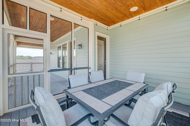353 Spicer Lake Dr, Holly Ridge, NC 28445 - view of patio featuring outdoor dining space and covered porch
