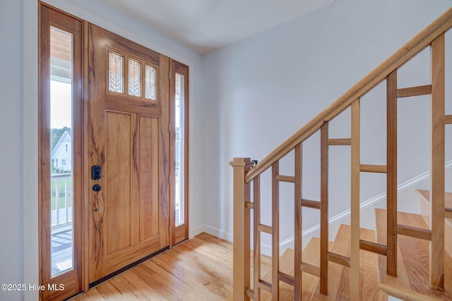 353 Spicer Lake Dr, Holly Ridge, NC 28445 - foyer entrance with plenty of natural light, stairs, and light wood-style floors