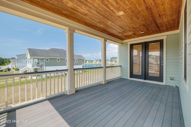 353 Spicer Lake Dr, Holly Ridge, NC 28445 - wooden terrace featuring a residential view and a water view