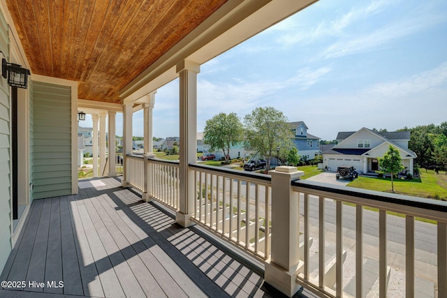 353 Spicer Lake Dr, Holly Ridge, NC 28445 - wooden deck with a residential view and covered porch