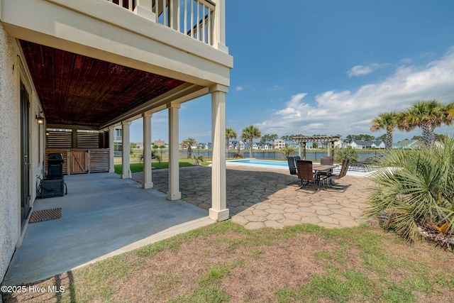 353 Spicer Lake Dr, Holly Ridge, NC 28445 - view of patio featuring an outdoor pool and a pergola