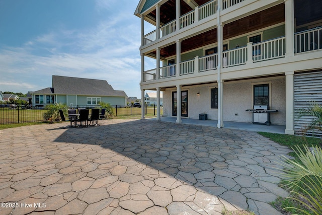 353 Spicer Lake Dr, Holly Ridge, NC 28445 - back of property with a patio and fence
