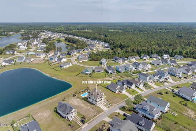 353 Spicer Lake Dr, Holly Ridge, NC 28445 - aerial overview of property's location featuring a large body of water, nearby suburban area, and a forest