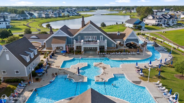 353 Spicer Lake Dr, Holly Ridge, NC 28445 - community pool featuring a residential view, a patio, and a water view