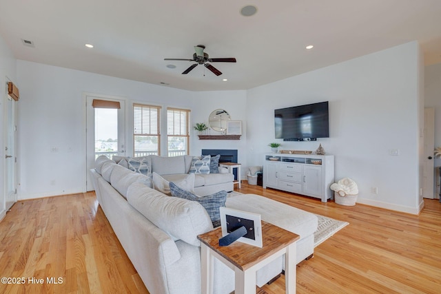 353 Spicer Lake Dr, Holly Ridge, NC 28445 - living room with ceiling fan, a fireplace, light wood finished floors, recessed lighting, and baseboards