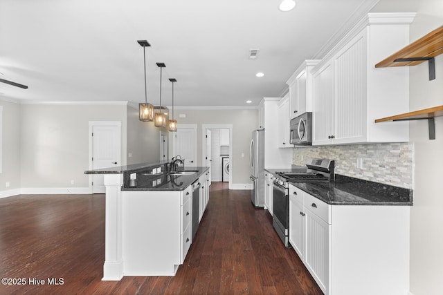 1213 Daisy Ct, Holly Ridge, NC 28445 - kitchen with stainless steel appliances, open shelves, a sink, white cabinets, and an island with sink