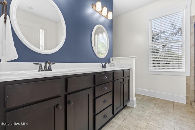 1213 Daisy Ct, Holly Ridge, NC 28445 - bathroom featuring tile patterned floors, double vanity, and baseboards