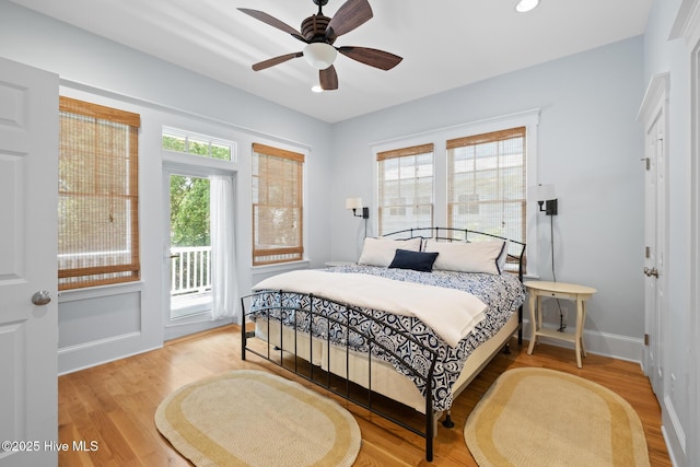bedroom featuring access to exterior, wood finished floors, baseboards, recessed lighting, and ceiling fan
