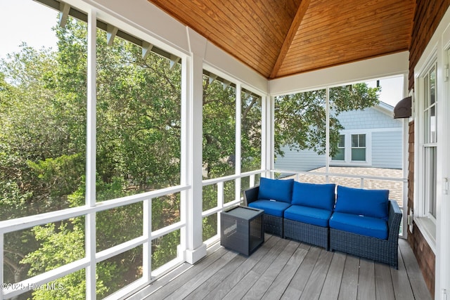 sunroom / solarium with an outdoor living space and lofted ceiling