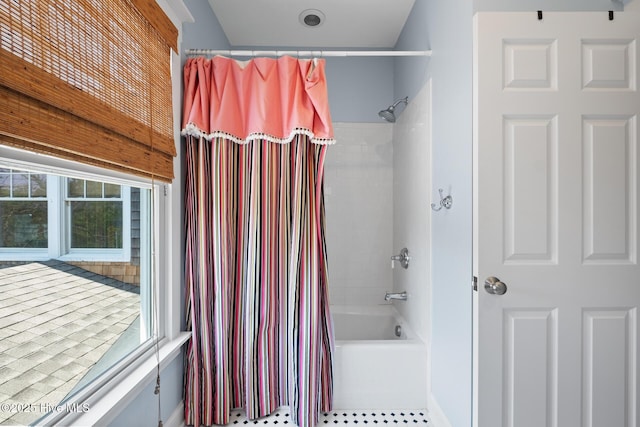 bathroom with shower / bathtub combination with curtain