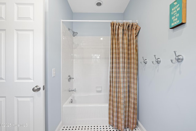 bathroom with baseboards, shower / tub combo with curtain, and tile patterned floors