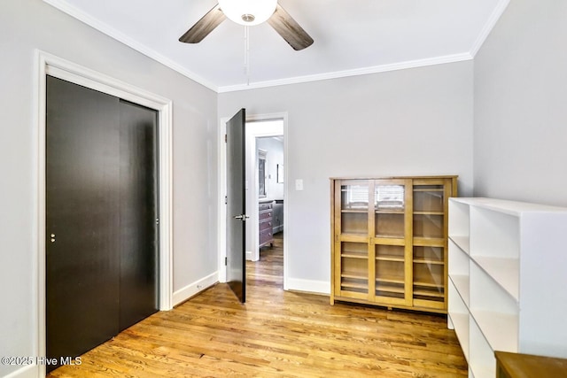 1111 Baxter St, Elizabeth City, NC 27909 - unfurnished room featuring ornamental molding, wood finished floors, and a ceiling fan