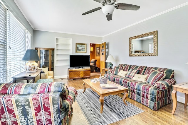 1111 Baxter St, Elizabeth City, NC 27909 - living room with wood finished floors, crown molding, ceiling fan, and built in shelves