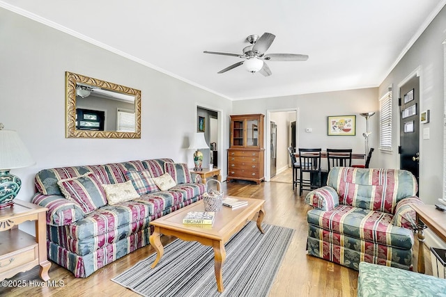 1111 Baxter St, Elizabeth City, NC 27909 - living room featuring wood finished floors, ornamental molding, and a ceiling fan