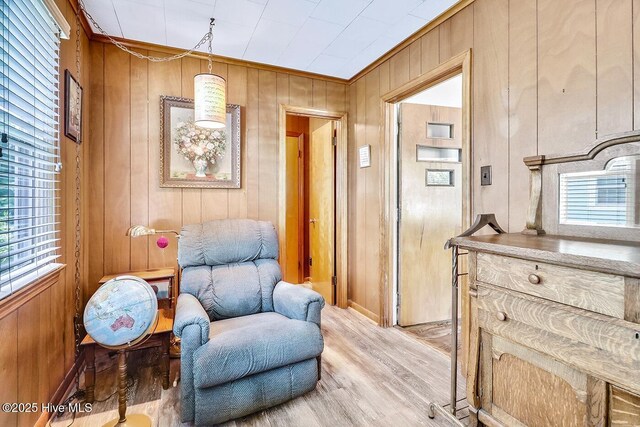 1111 Baxter St, Elizabeth City, NC 27909 - sitting room with light wood finished floors and wooden walls