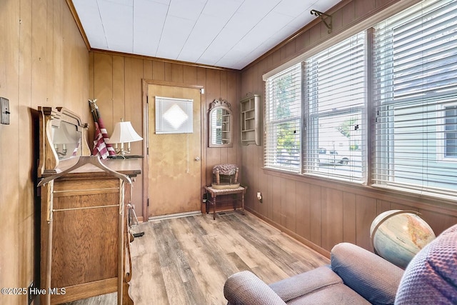 1111 Baxter St, Elizabeth City, NC 27909 - living area featuring wooden walls, light wood finished floors, and crown molding