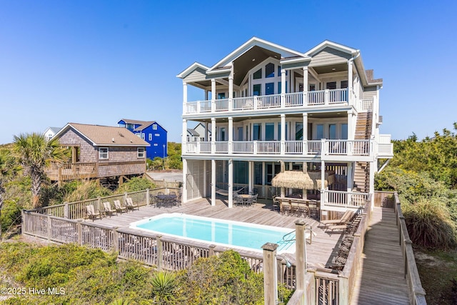 back of property with a balcony