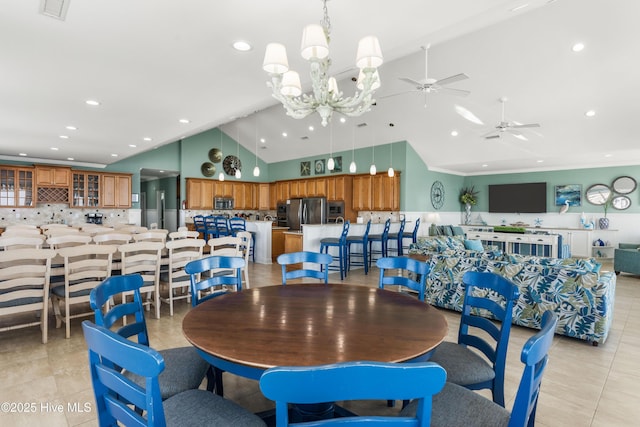 dining area with a ceiling fan, light tile patterned floors, high vaulted ceiling, a chandelier, and recessed lighting