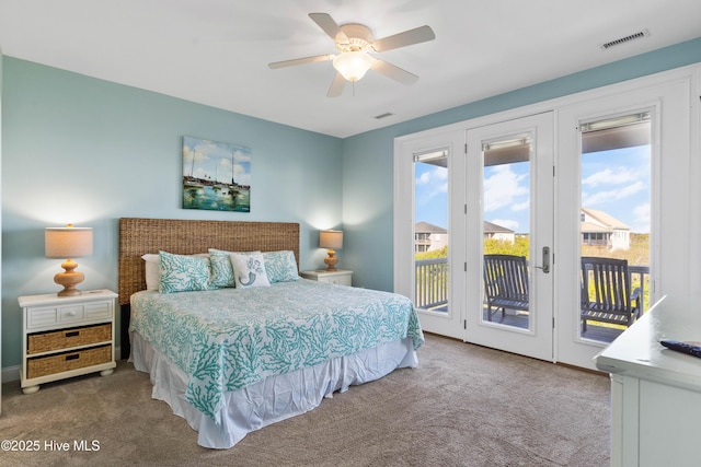 carpeted bedroom featuring access to exterior and a ceiling fan