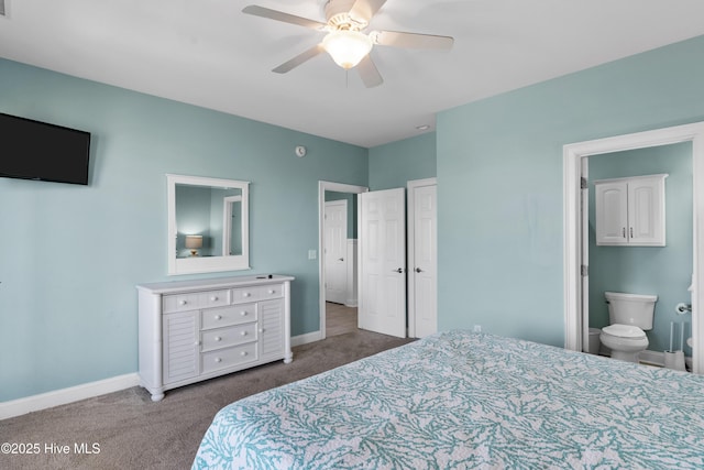 carpeted bedroom with baseboards, ensuite bath, and ceiling fan